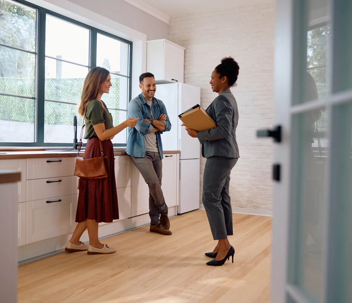 Real estate agent showing a kitchen